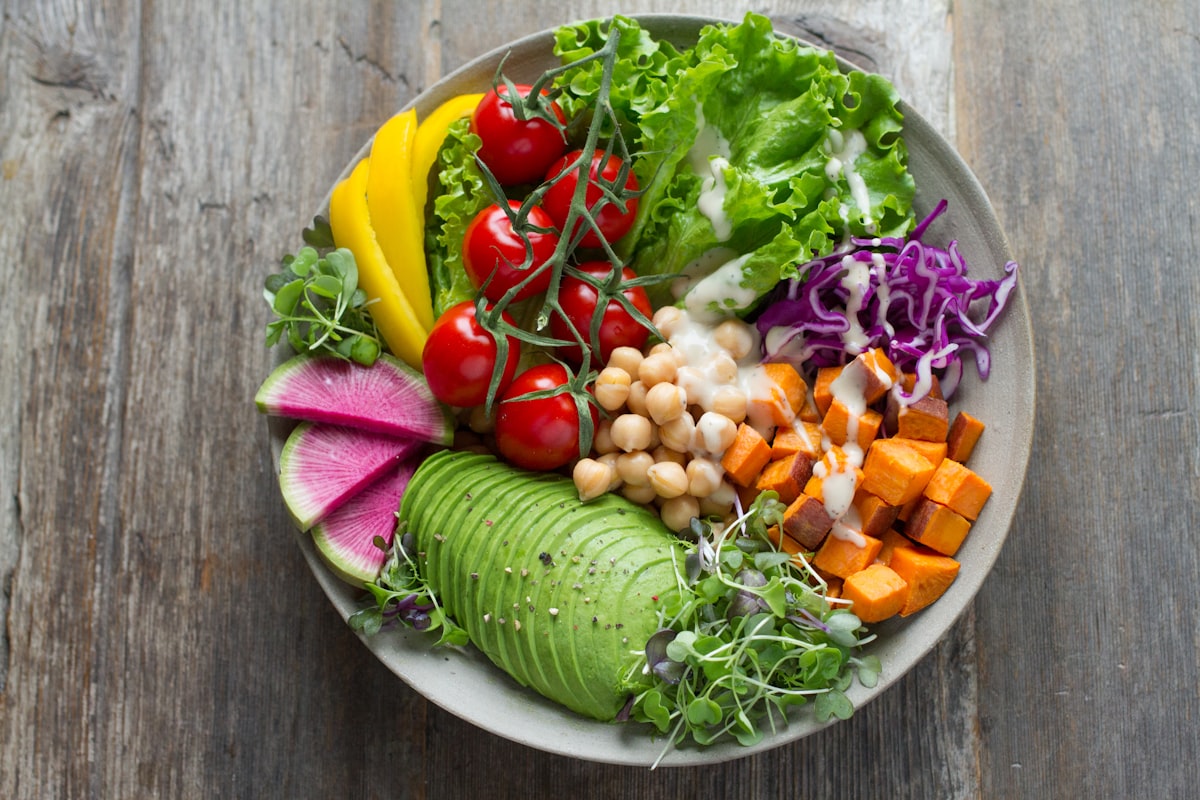 Colorful salad with mixed vegetables, chickpeas, and olive oil dressing